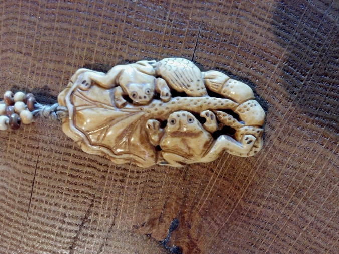 Close up of frog pendant