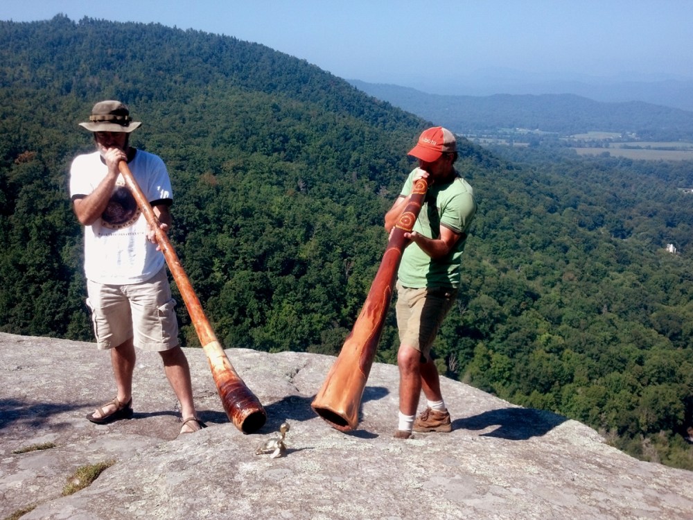 Didgeridoo and the Turtle of Change on top of a remote rock outcrop.  
